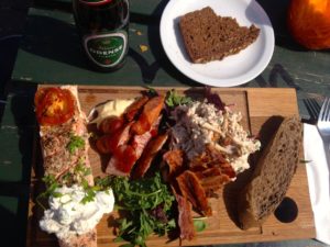 Various foods and breads on a board