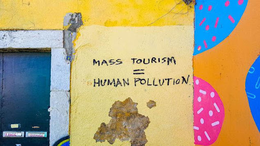 mass tourism is human pollution grafitti