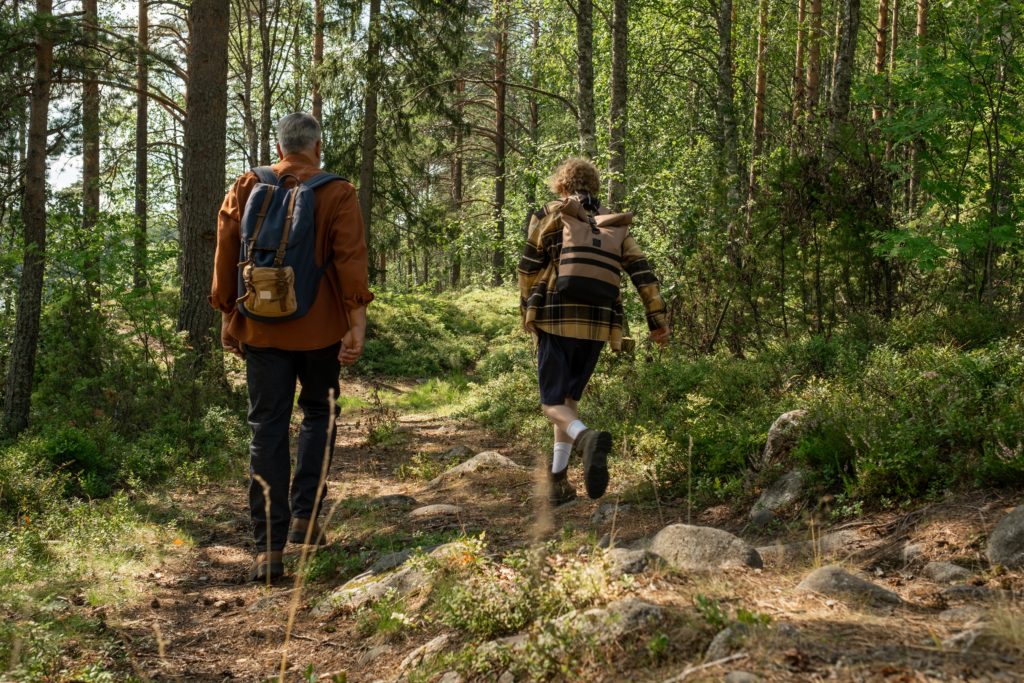 Father and son hiking in national park in US