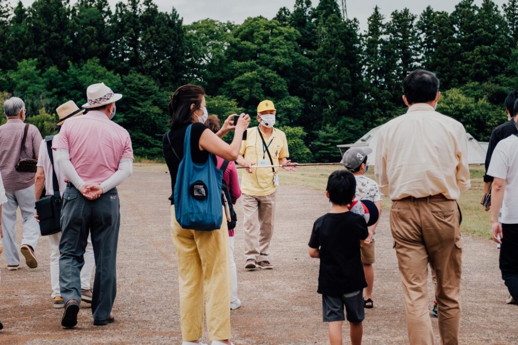 A local tour guide takes a group of travelers through Chichen Itza