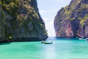 Maya Bay, a popular area in Thailand that had to be closed off due to overtourism and seasonality.